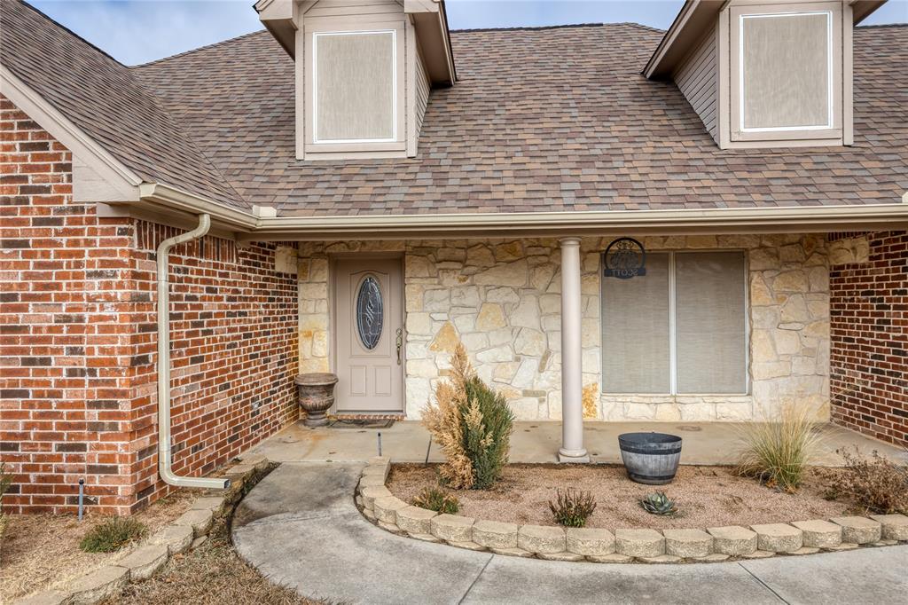 257 Reatta Drive Decatur, TX 76234 - Photo 2 of 39 a front view of a house with a yard