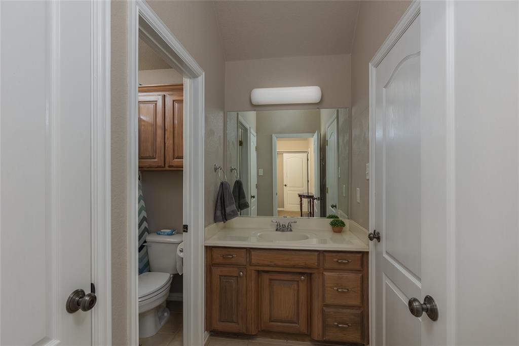 257 Reatta Drive Decatur, TX 76234 - Photo 27 of 39 a bathroom with a sink and a mirror
