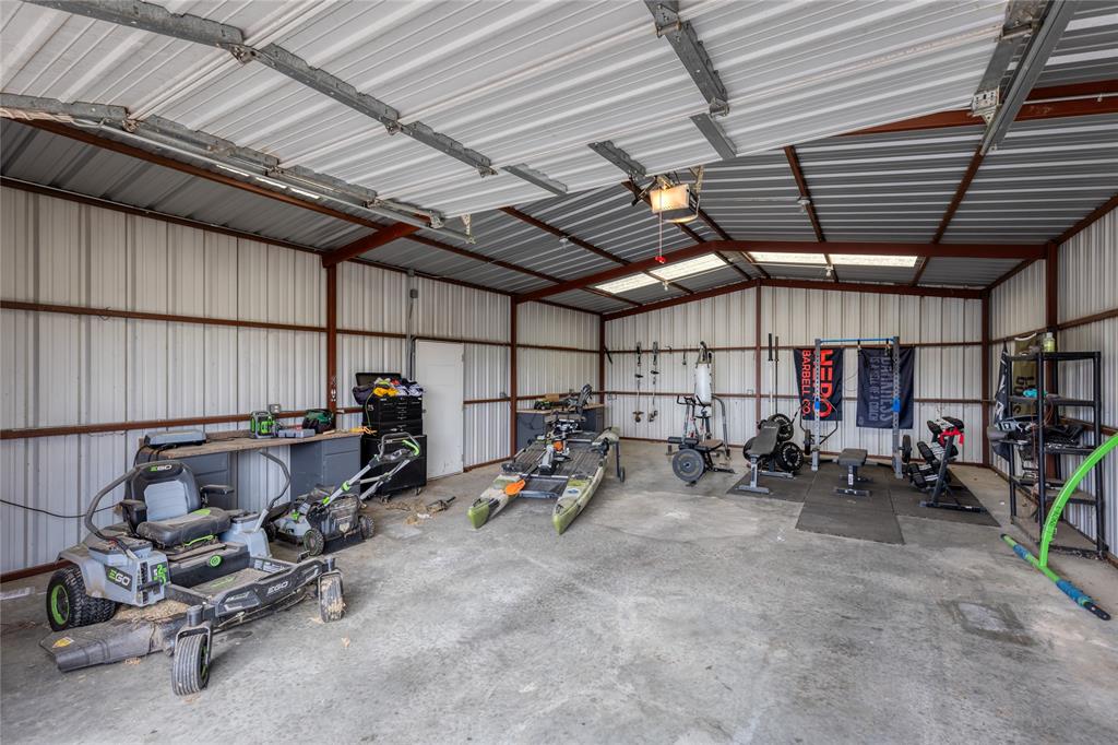 257 Reatta Drive Decatur, TX 76234 - Photo 5 of 39 a view of a garage with a table and chairs
