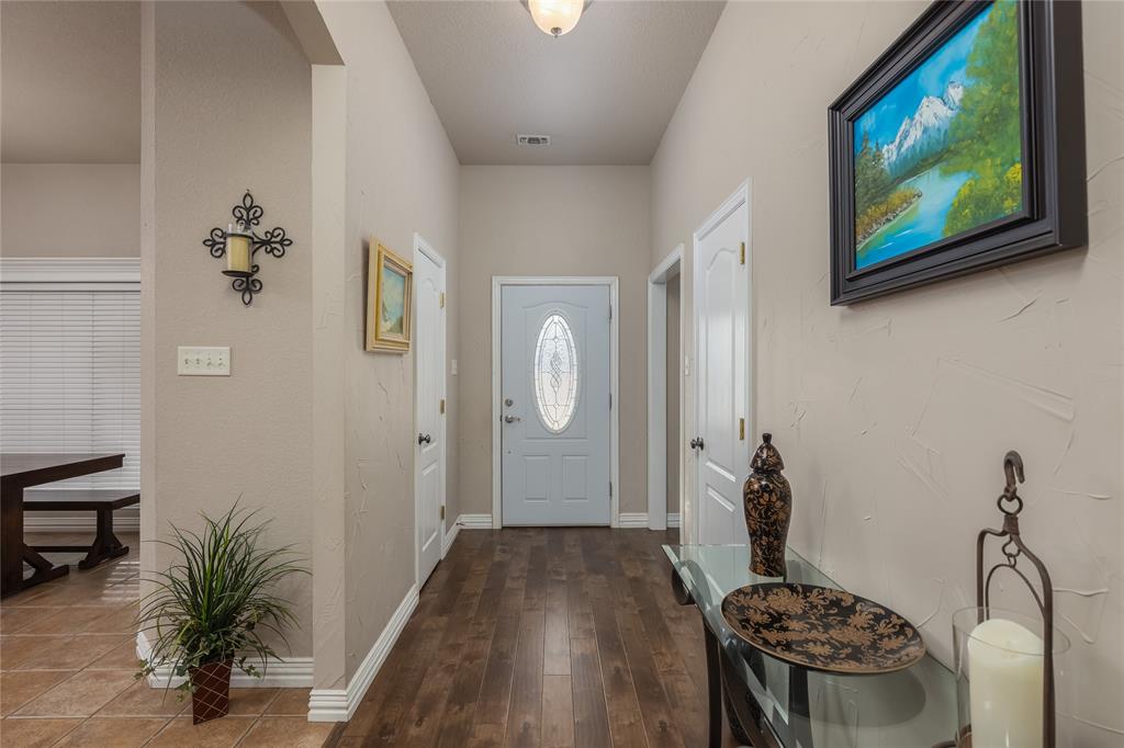 257 Reatta Drive Decatur, TX 76234 - Photo 8 of 39 a bathroom with a sink and a mirror