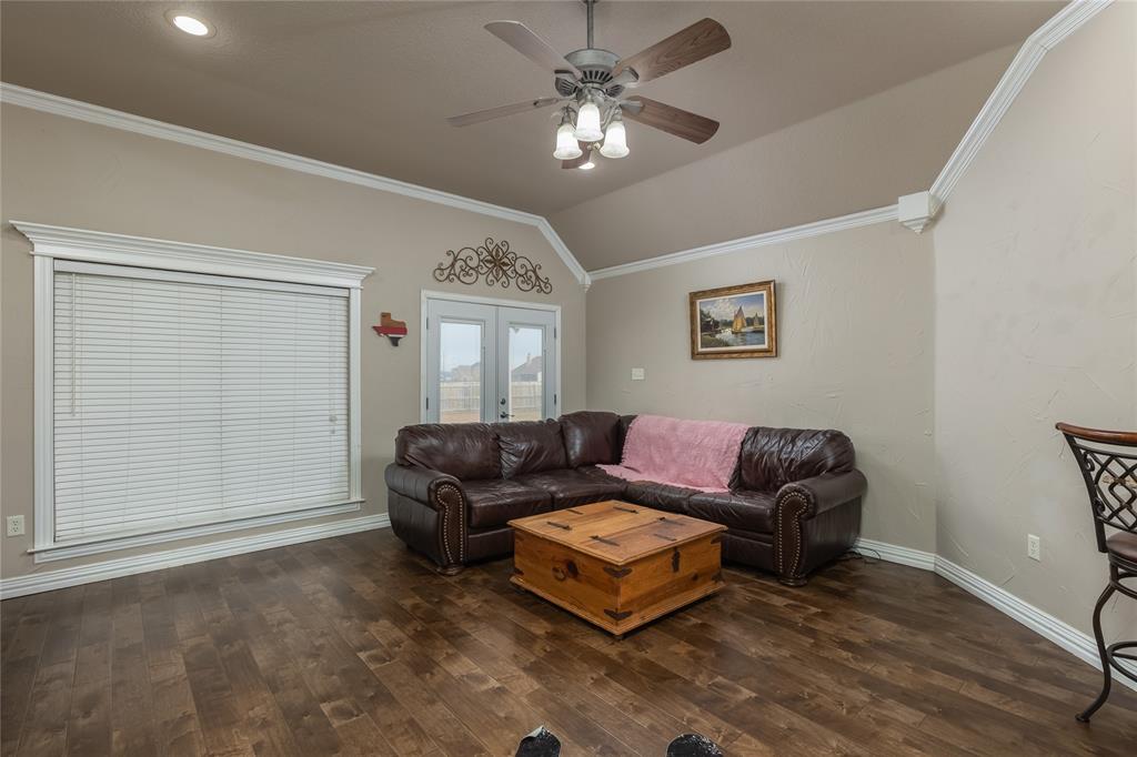 257 Reatta Drive Decatur, TX 76234 - Photo 10 of 39 a living room with furniture a ceiling fan and a window