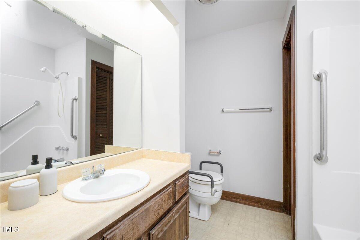 11637 Appaloosa Run West Raleigh, NC 27613 - Photo 17 of 29 a bathroom with a granite countertop sink and a mirror