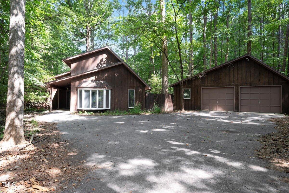 11637 Appaloosa Run West Raleigh, NC 27613 - Photo 2 of 29 a front view of a house with a yard and garage