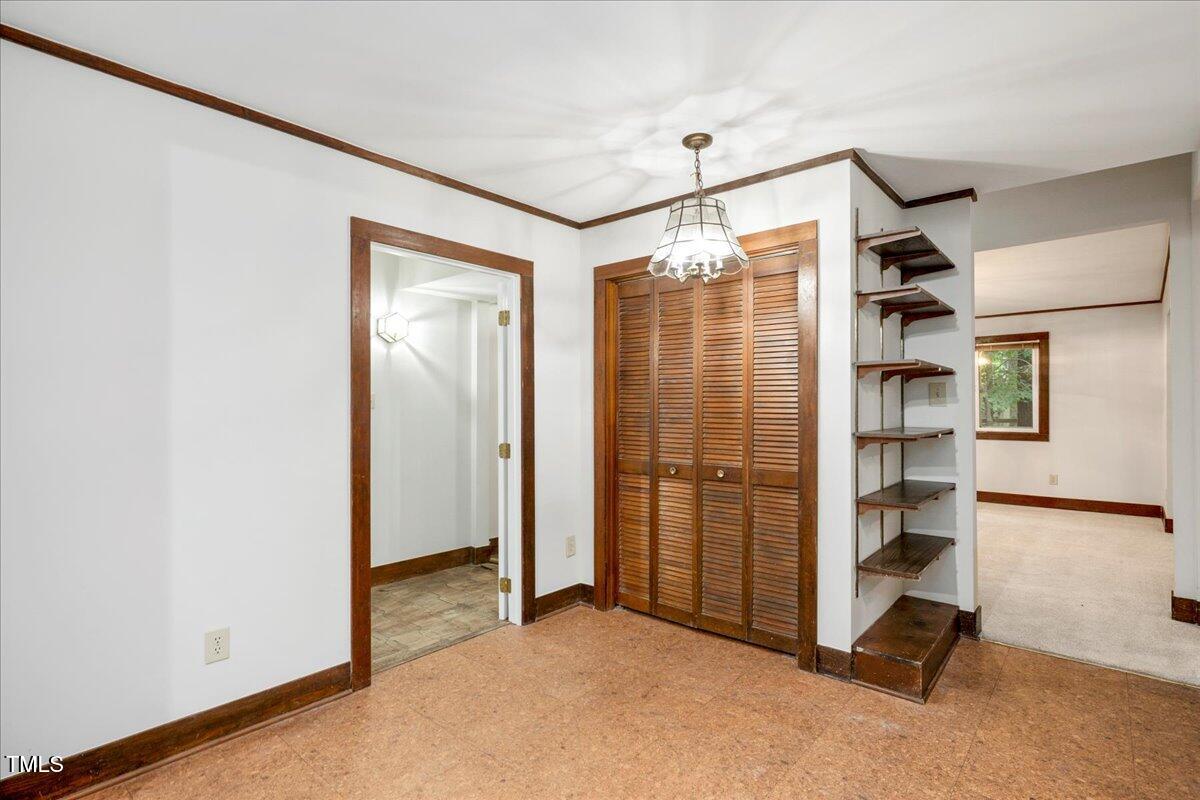 11637 Appaloosa Run West Raleigh, NC 27613 - Photo 9 of 29 a view of workspace with closet and window