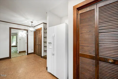 a view of a bathroom with a shower and closet