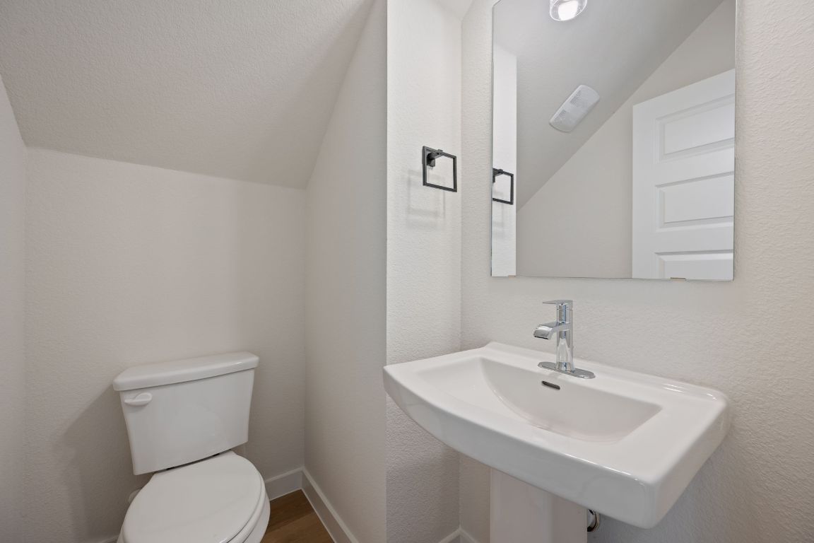 2600 Gattis School Road, Unit 1202 Round Rock, TX 78664 - Photo 10 of 24 Bathroom with a textured wall and vaulted ceiling