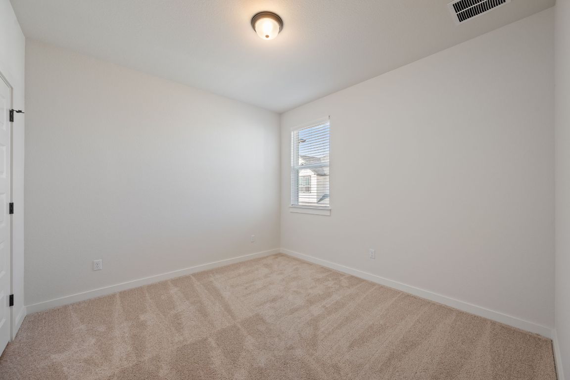 2600 Gattis School Road, Unit 1202 Round Rock, TX 78664 - Photo 15 of 24 Carpeted empty room with baseboards