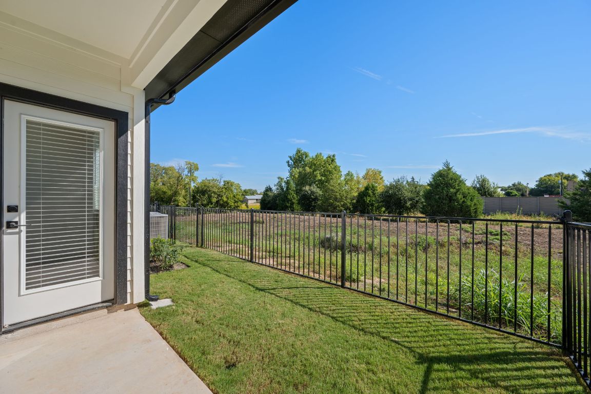 2600 Gattis School Road, Unit 1202 Round Rock, TX 78664 - Photo 21 of 24 Fenced backyard with a patio