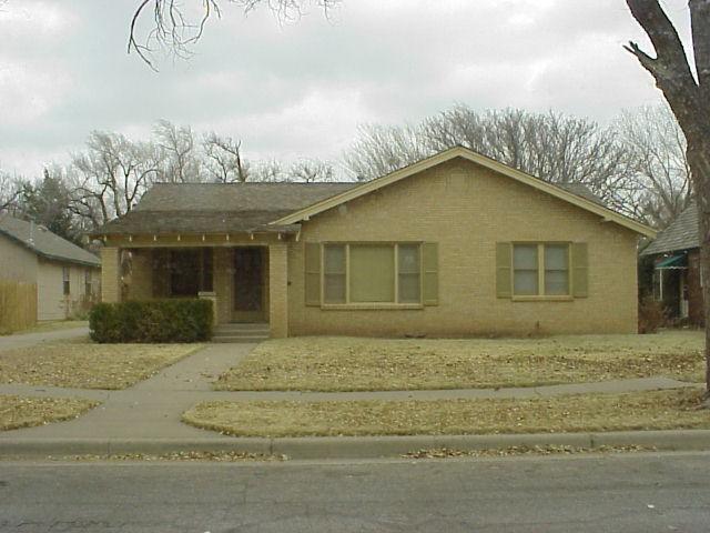 2111 South Hayden Street Amarillo, TX 79109 - Photo 1 of 1 a yellow house with trees in front of it