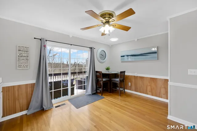 a view of a livingroom with furniture window and wooden floor