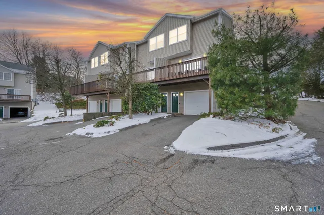 a view of a two chairs on the roof deck