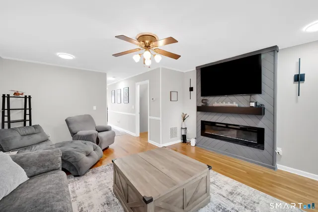 a living room with furniture and a flat screen tv