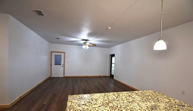 a view of an empty room with a window