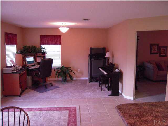 4762 Ribault Lane Milton, FL 32570 - Photo 12 of 24 View of den from kitchen. Door to the right is the great room.