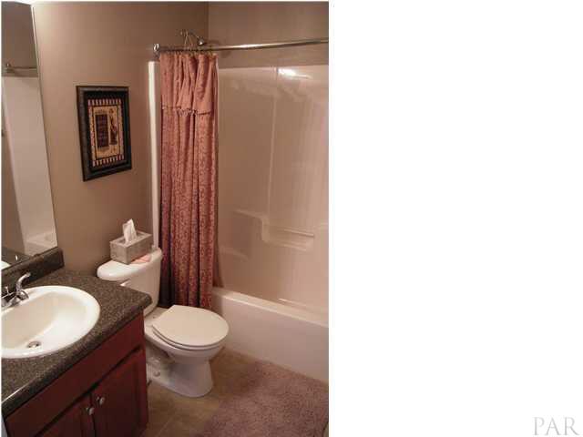 4762 Ribault Lane Milton, FL 32570 - Photo 14 of 24 Full bath between bedrooms 1 & 2. New tile flooring 09/08.