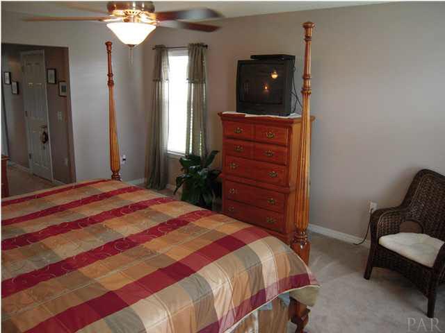 4762 Ribault Lane Milton, FL 32570 - Photo 21 of 24 Another view of master. Notice all the windows. 3 total.