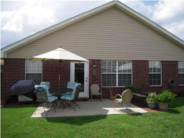 4762 Ribault Lane Milton, FL 32570 - Photo 24 of 24 Patio measures 10 x 18 with an extended 3 x 7 area for your grill.