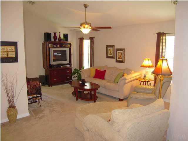 4762 Ribault Lane Milton, FL 32570 - Photo 4 of 24 Looking at great room from foyer. Dining room & door to kitchen to your left. New ceiling fan 9/08. Ceiling peaks just under 13'.