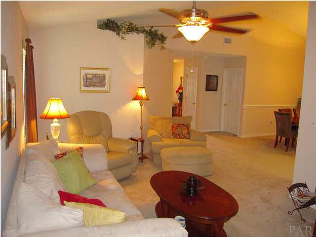 4762 Ribault Lane Milton, FL 32570 - Photo 5 of 24 View of great room from den. Dining room to your right. A glimpse of foyer straight ahead.