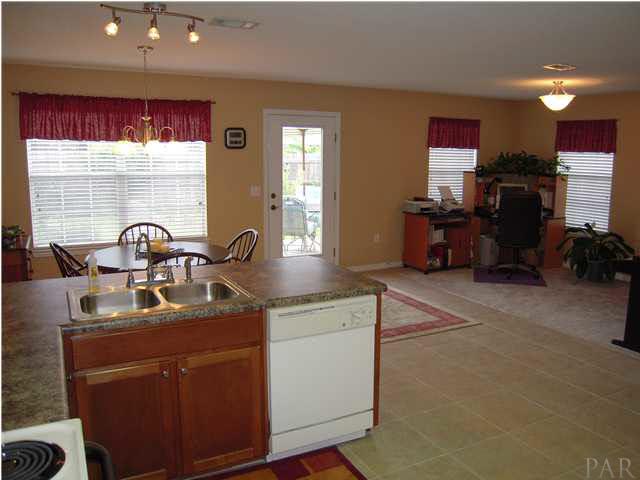 4762 Ribault Lane Milton, FL 32570 - Photo 8 of 24 Kitchen has new tile & light fixtues! Den/office to your right. New tile flooring 09/08.