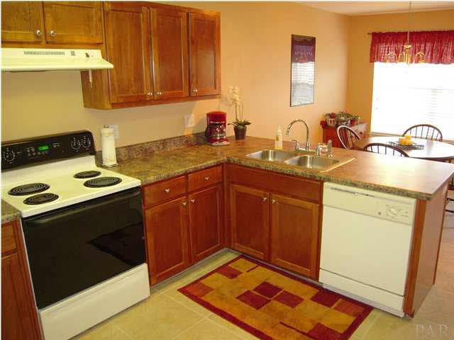 4762 Ribault Lane Milton, FL 32570 - Photo 9 of 24 Looking towards breakfast area with view of backyard.