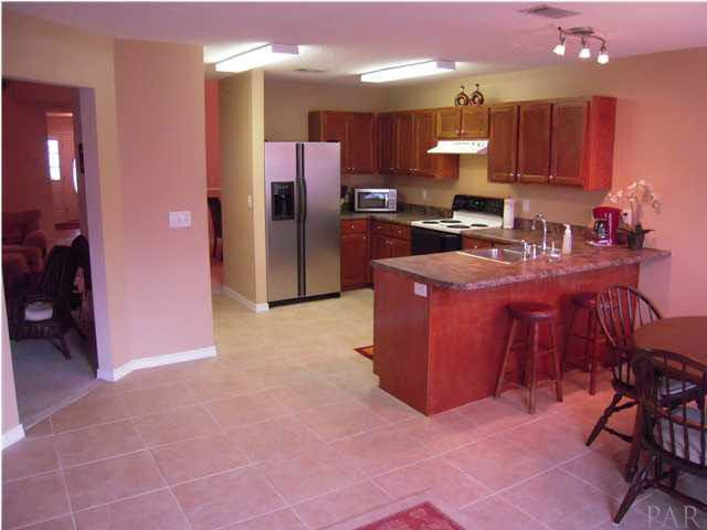 4762 Ribault Lane Milton, FL 32570 - Photo 10 of 24 View of kitchen from den. Great room is door to your left.