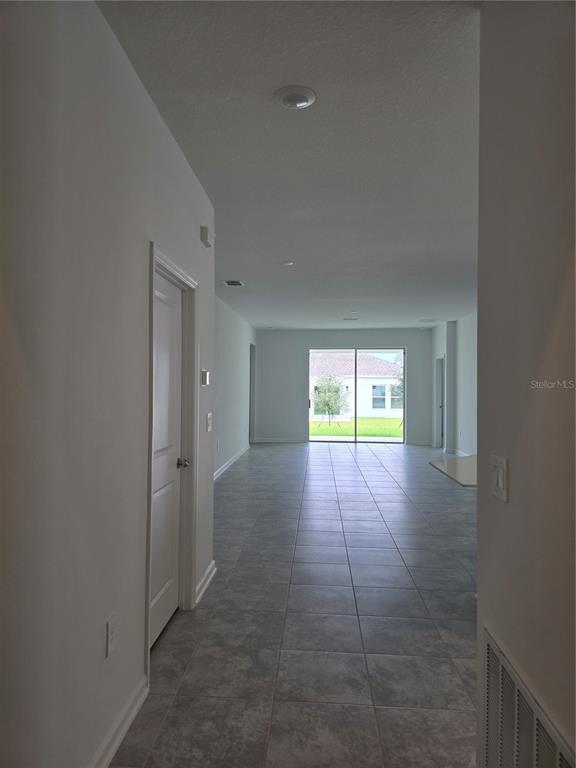 1767 Foreman Road Eagle Lake, FL 33839 - Photo 6 of 30 an empty room with windows and entrance