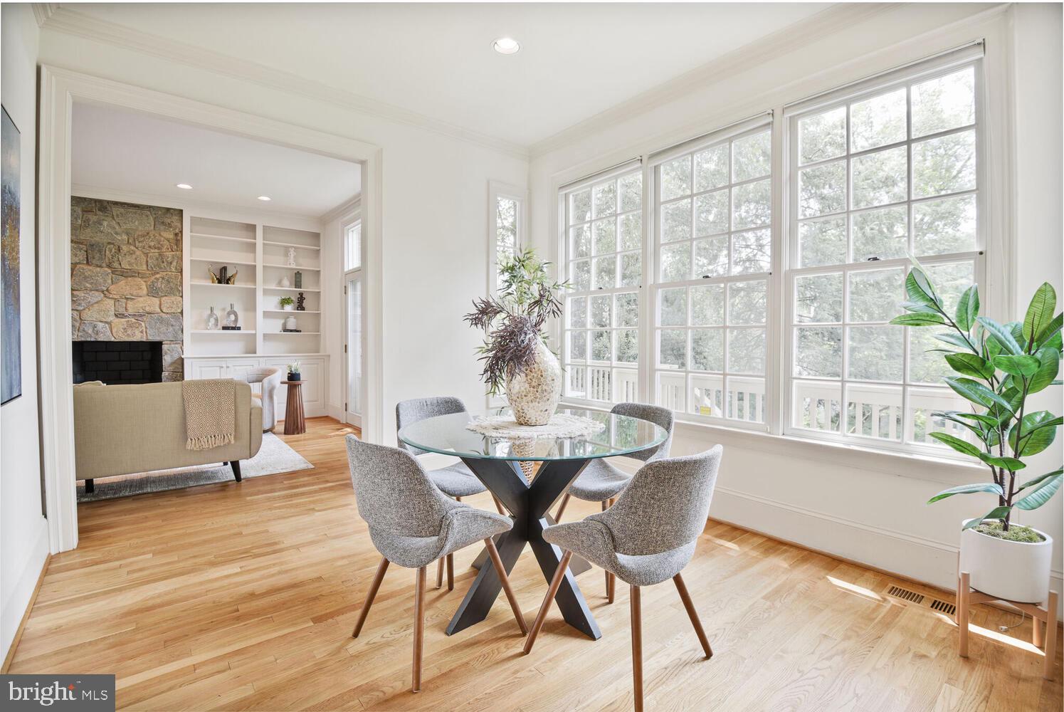 5222 Loughboro Road Northwest Washington, DC 20016 - Photo 14 of 47 a view of a dining room with furniture window and wooden floor