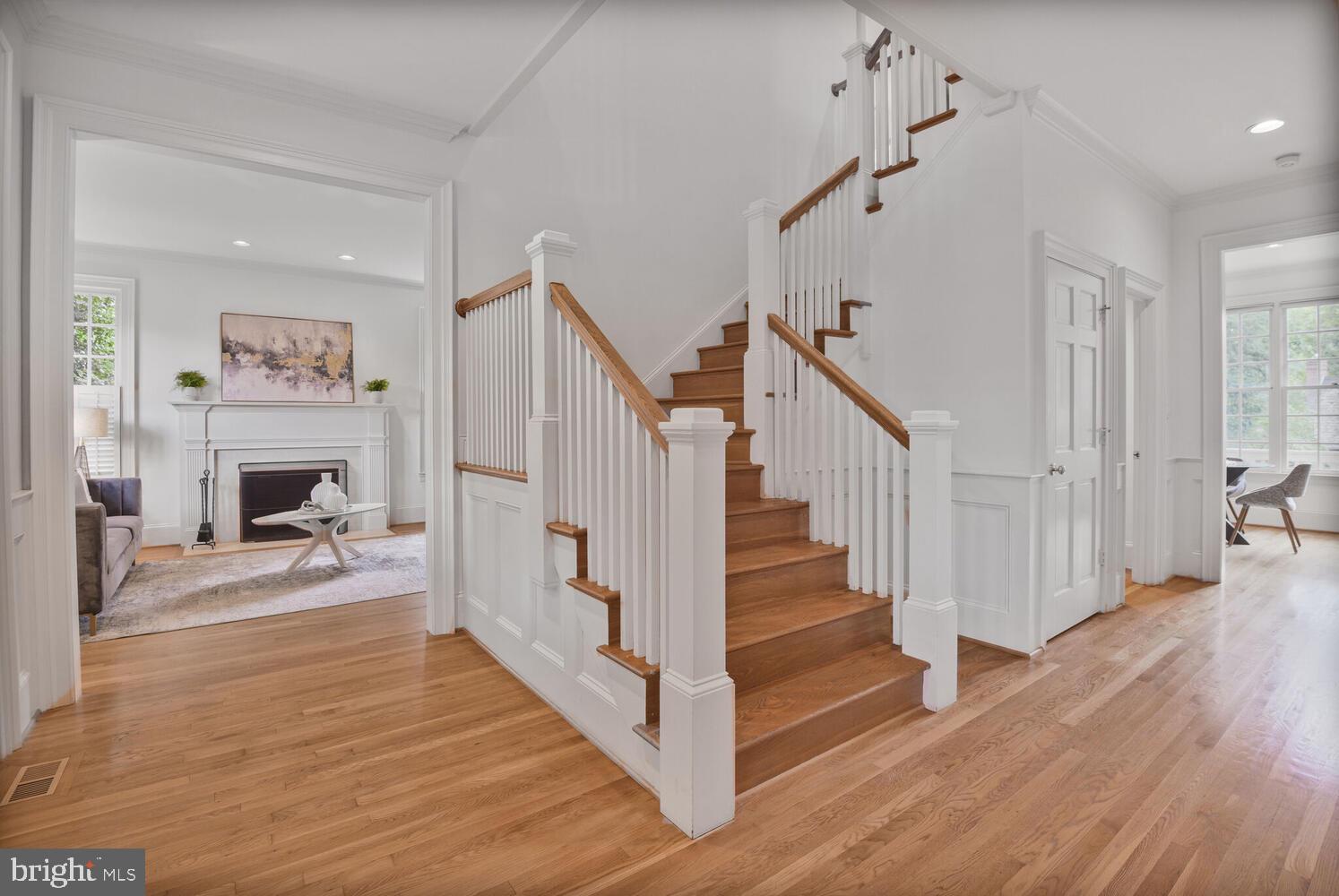 5222 Loughboro Road Northwest Washington, DC 20016 - Photo 2 of 47 a view of a livingroom with wooden floor and staircase