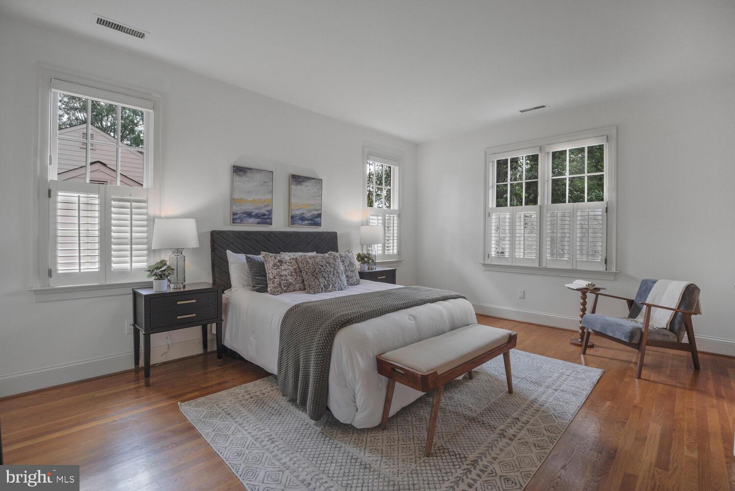 5222 Loughboro Road Northwest Washington, DC 20016 - Photo 24 of 47 a bedroom with a bed a table and chair