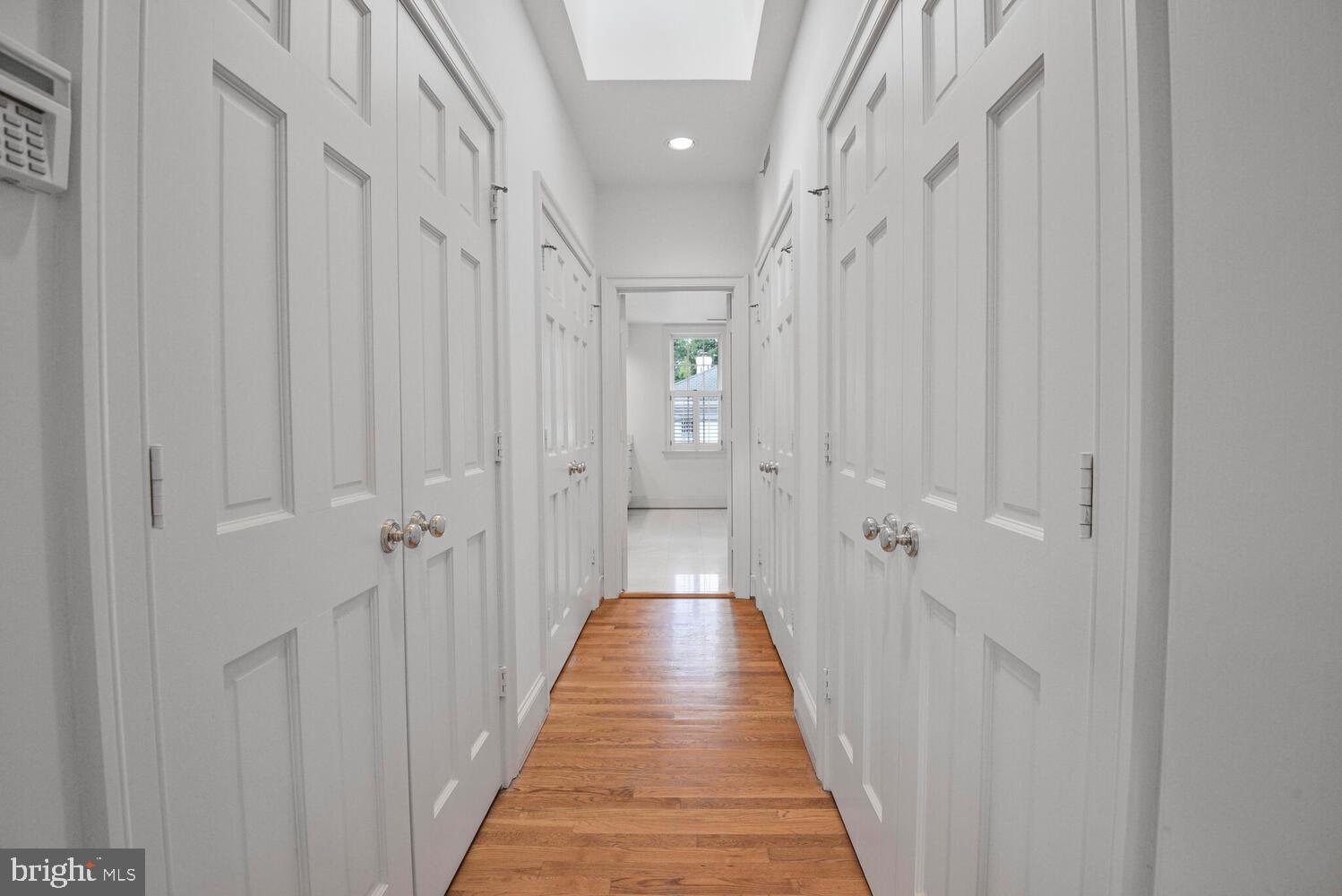 5222 Loughboro Road Northwest Washington, DC 20016 - Photo 26 of 47 a view of a hallway with wooden floor and staircase