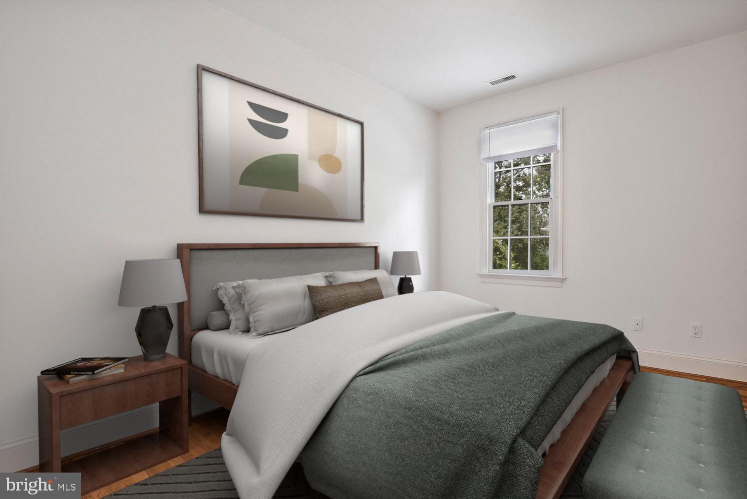 5222 Loughboro Road Northwest Washington, DC 20016 - Photo 29 of 47 a bedroom with a bed and wooden floor