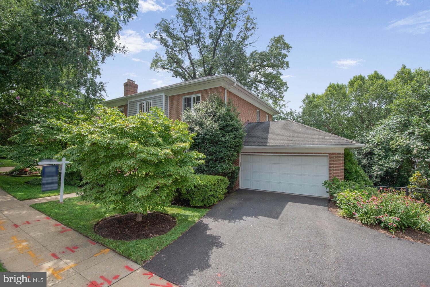 5222 Loughboro Road Northwest Washington, DC 20016 - Photo 40 of 47 a front view of a house with garden