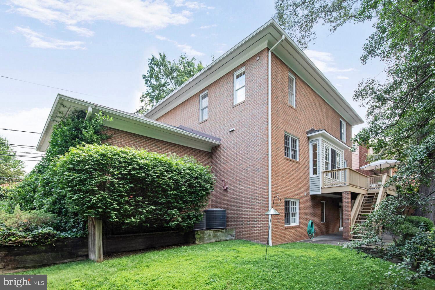 5222 Loughboro Road Northwest Washington, DC 20016 - Photo 41 of 47 a front view of a house with garden