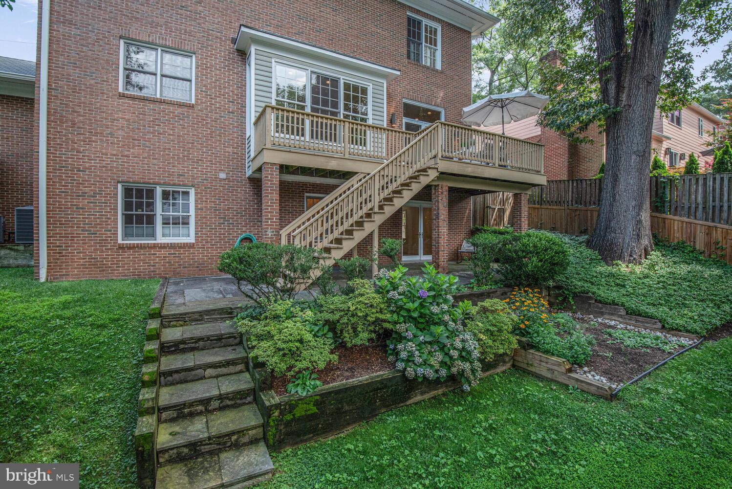 5222 Loughboro Road Northwest Washington, DC 20016 - Photo 42 of 47 a front view of a house with a yard