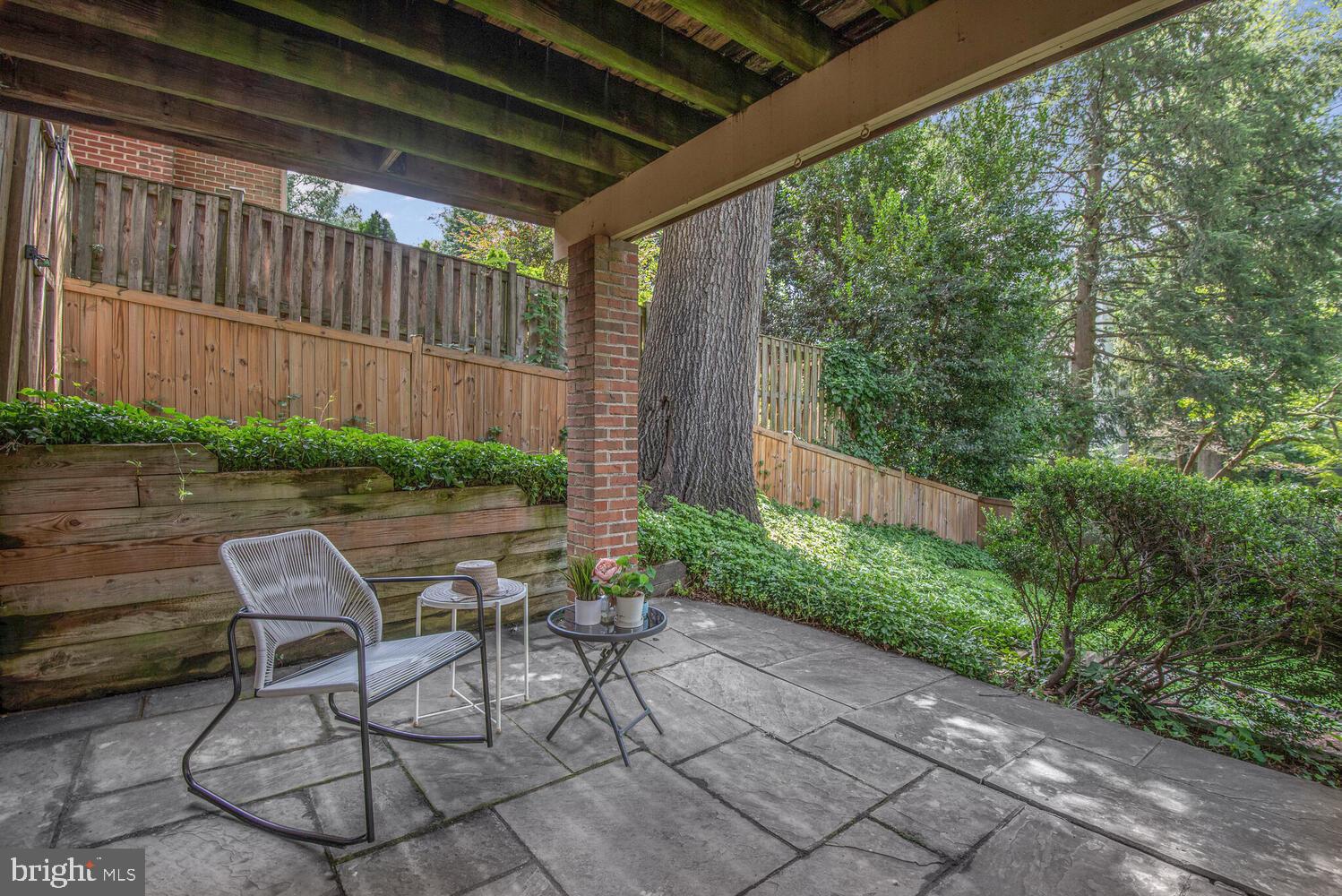 5222 Loughboro Road Northwest Washington, DC 20016 - Photo 44 of 47 a patio with yard glass top table and chairs
