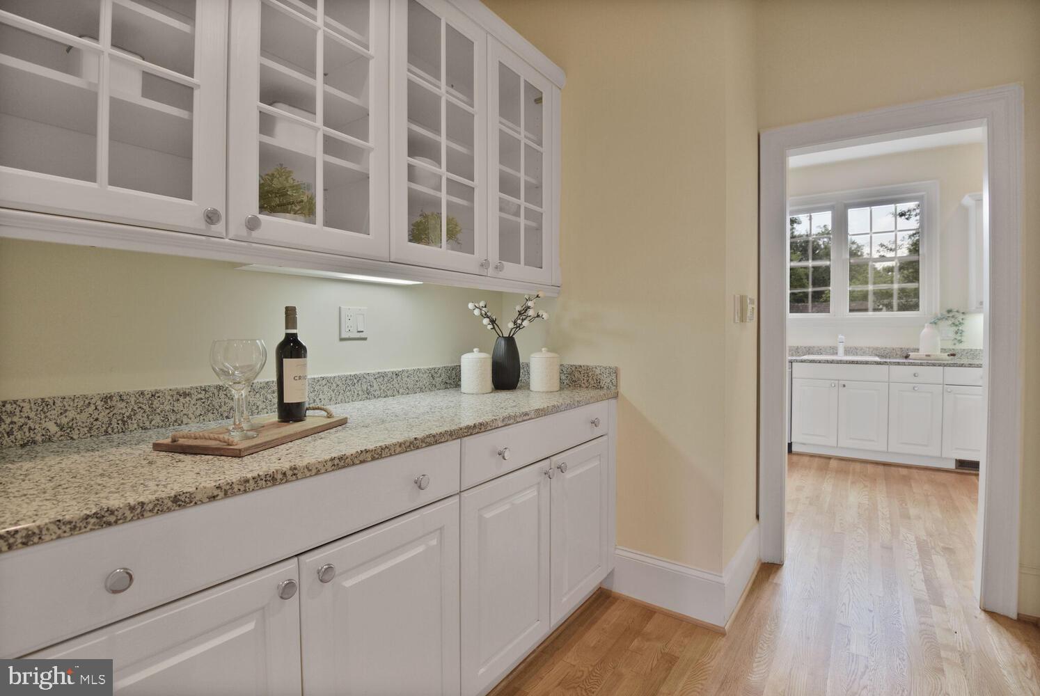 5222 Loughboro Road Northwest Washington, DC 20016 - Photo 7 of 47 a kitchen with a sink and cabinets