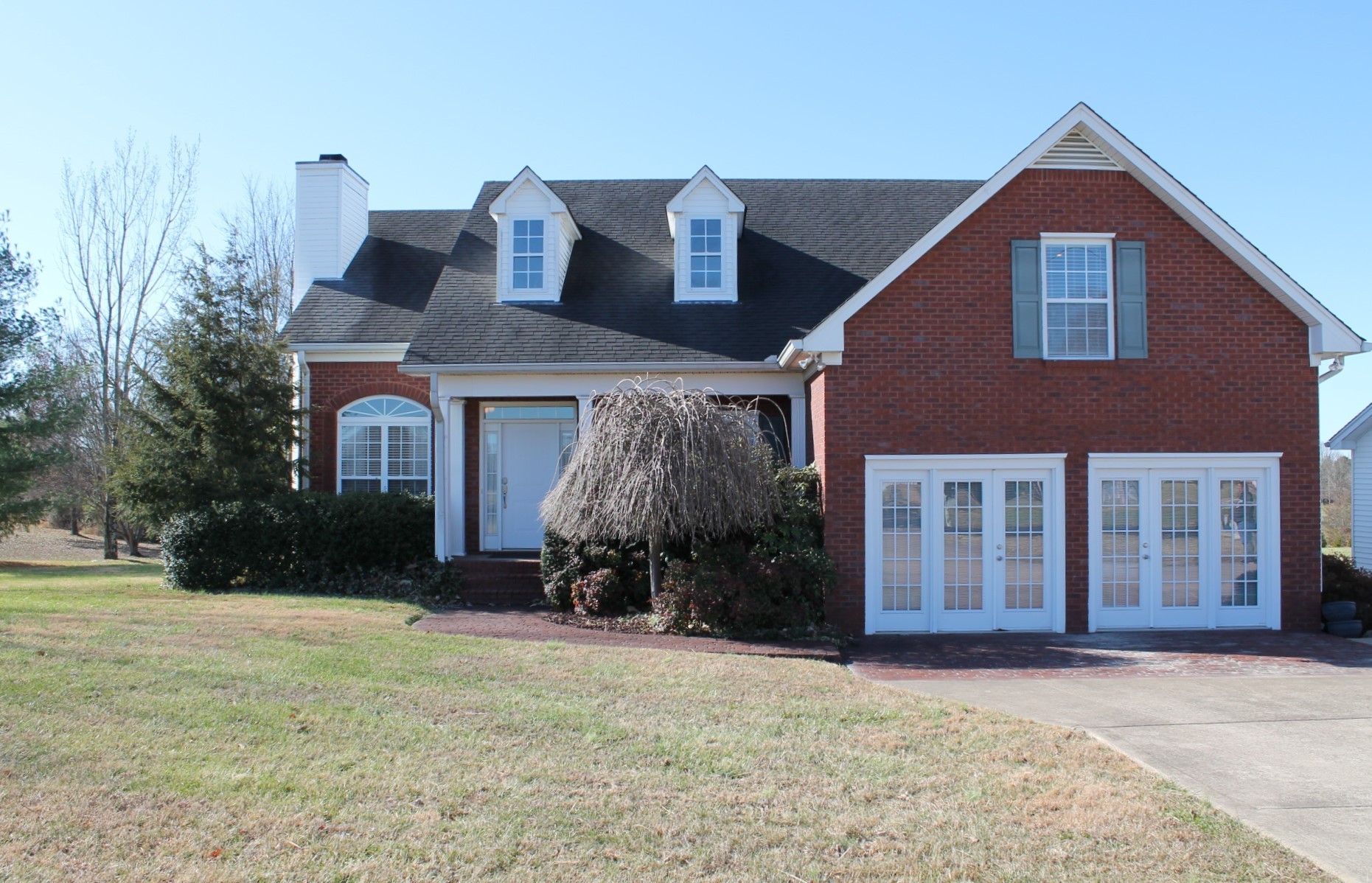 608 Fowler Ford Road Portland, TN 37148 - Photo 1 of 50 a front view of a house with garden