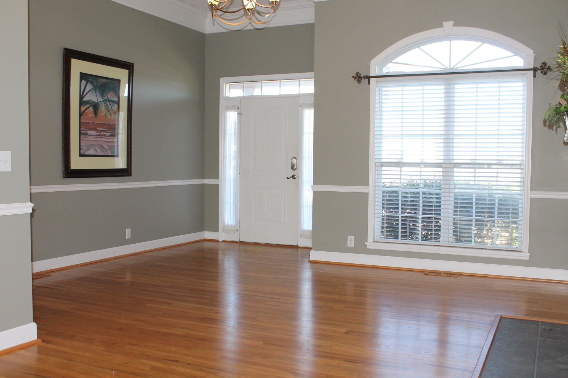 608 Fowler Ford Road Portland, TN 37148 - Photo 11 of 50 a view of an empty room with wooden floor and a window