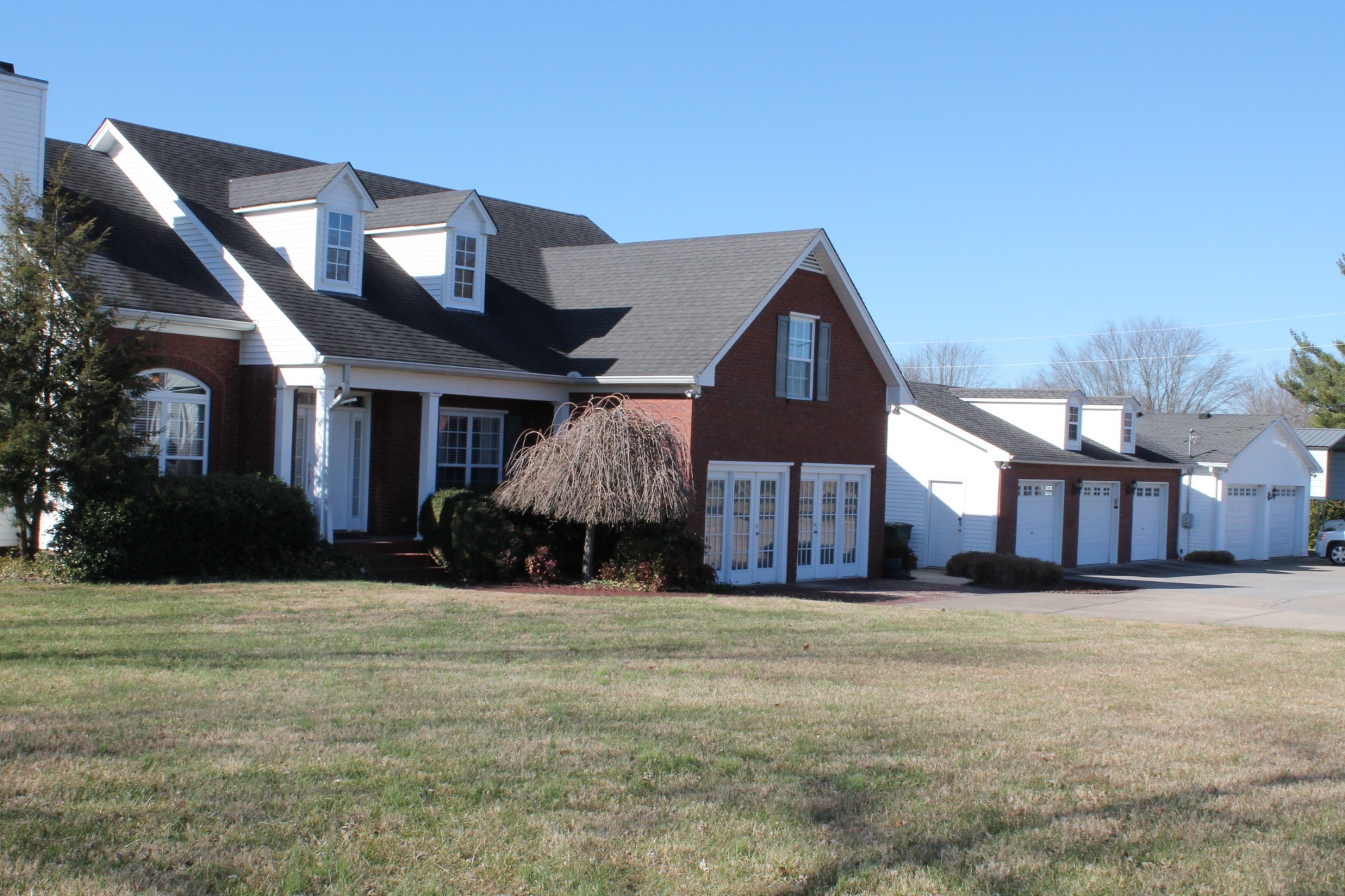608 Fowler Ford Road Portland, TN 37148 - Photo 3 of 50 a view of a house with a big yard and large trees