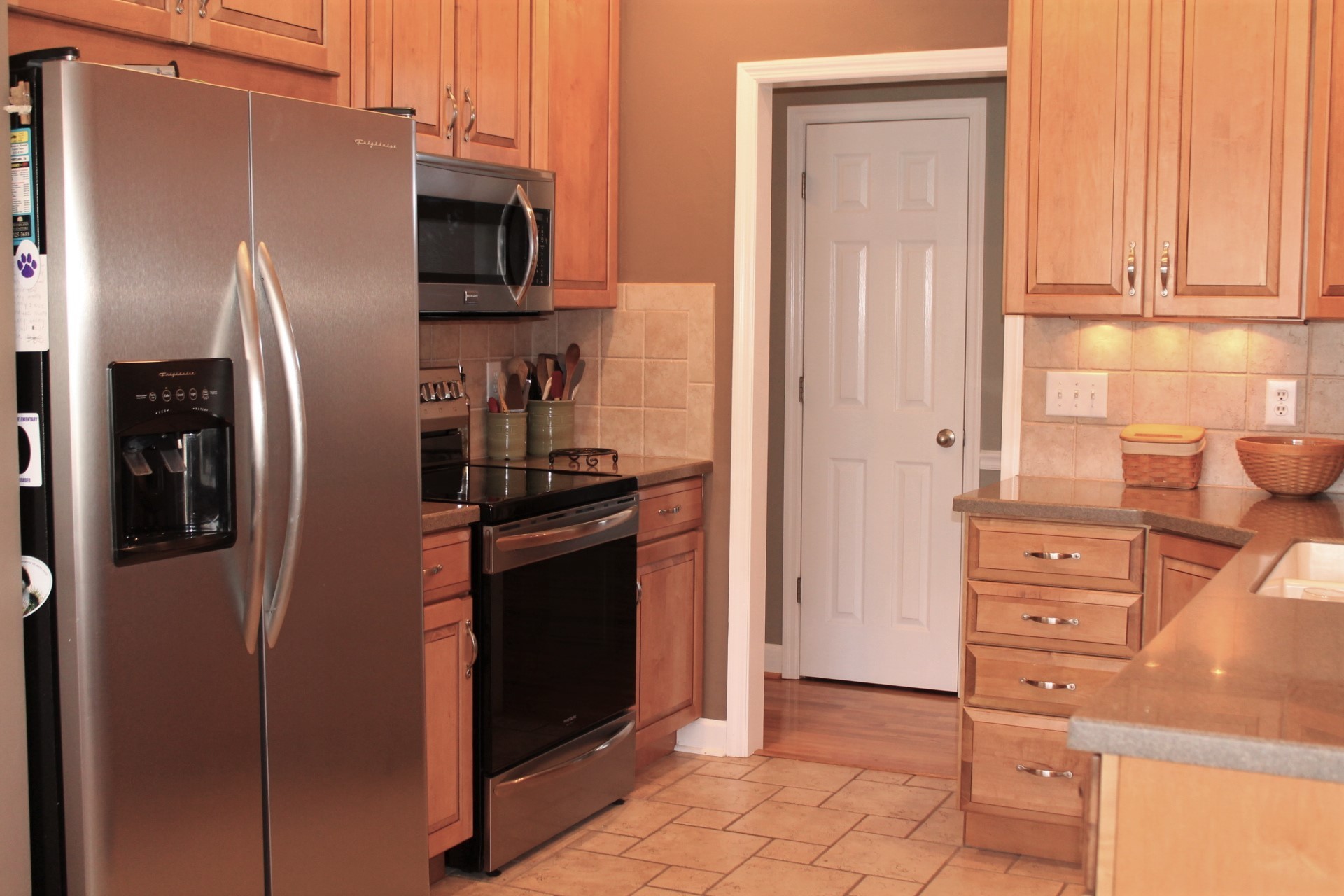 608 Fowler Ford Road Portland, TN 37148 - Photo 26 of 50 a kitchen with stainless steel appliances granite countertop a refrigerator and a stove