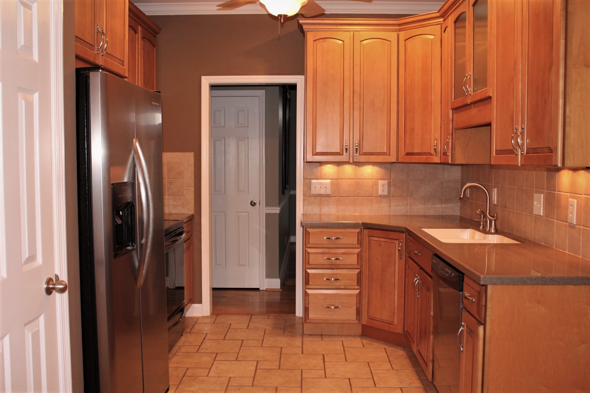 608 Fowler Ford Road Portland, TN 37148 - Photo 28 of 50 a kitchen with stainless steel appliances granite countertop a refrigerator and a sink