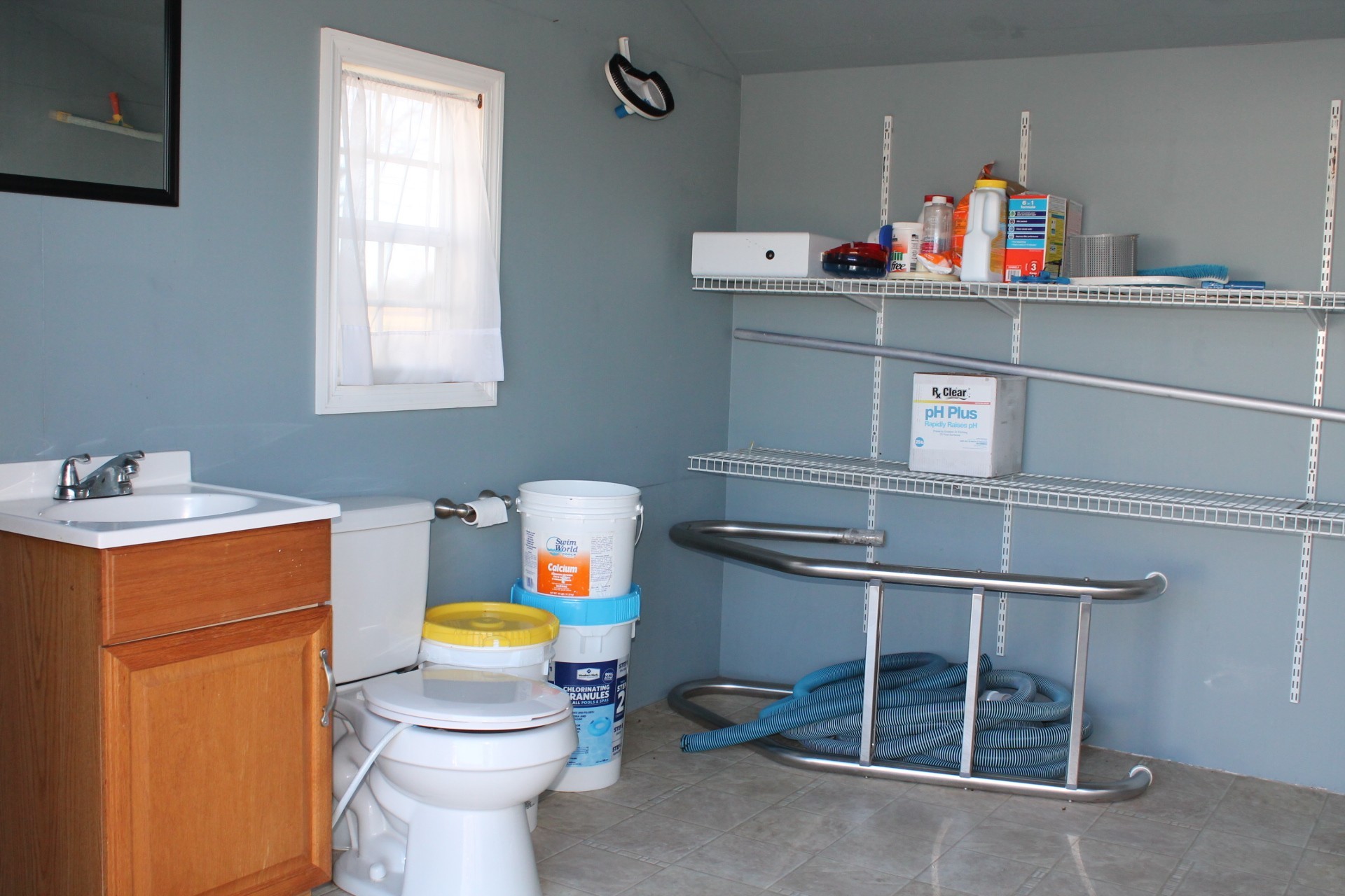 608 Fowler Ford Road Portland, TN 37148 - Photo 35 of 50 a bathroom with a sink toilet and window