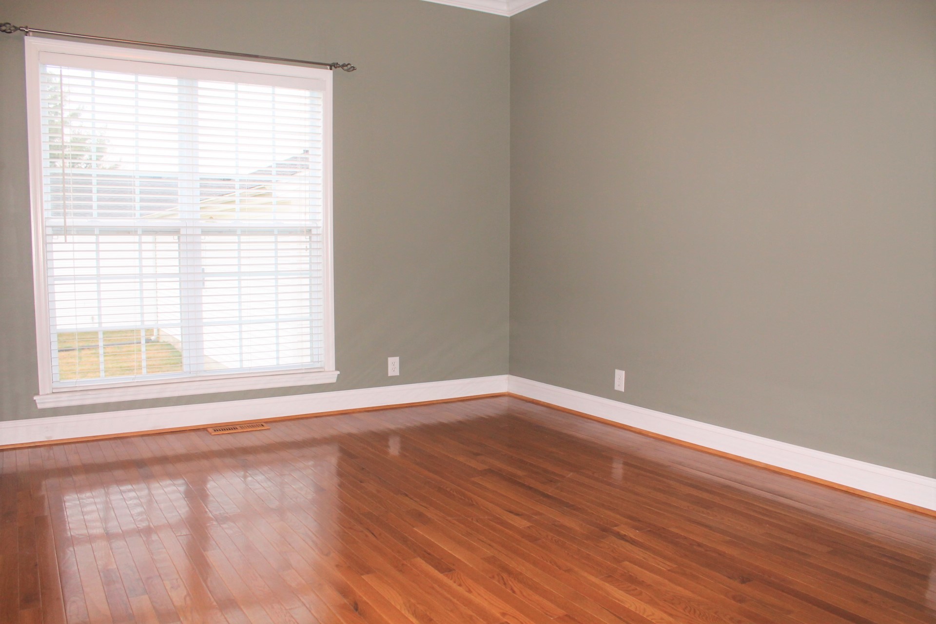 608 Fowler Ford Road Portland, TN 37148 - Photo 5 of 50 a view of an empty room with wooden floor and a window