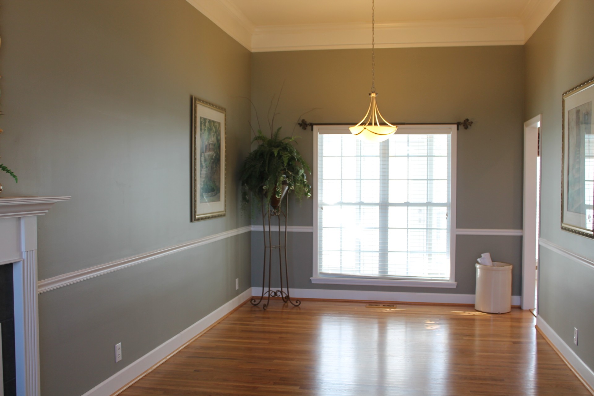 608 Fowler Ford Road Portland, TN 37148 - Photo 8 of 50 a view of an empty room with wooden floor and a window