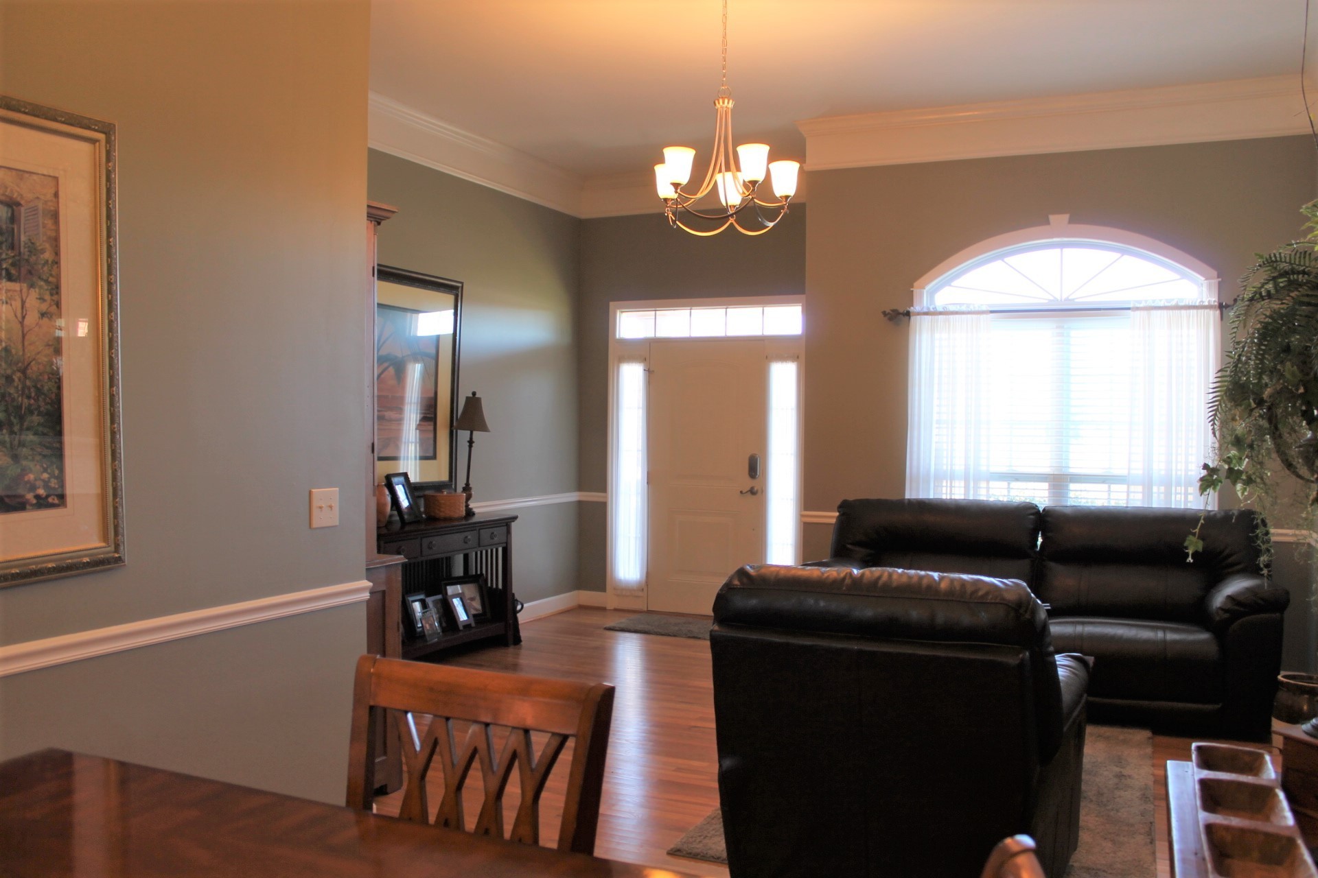608 Fowler Ford Road Portland, TN 37148 - Photo 9 of 50 a living room with furniture and a chandelier