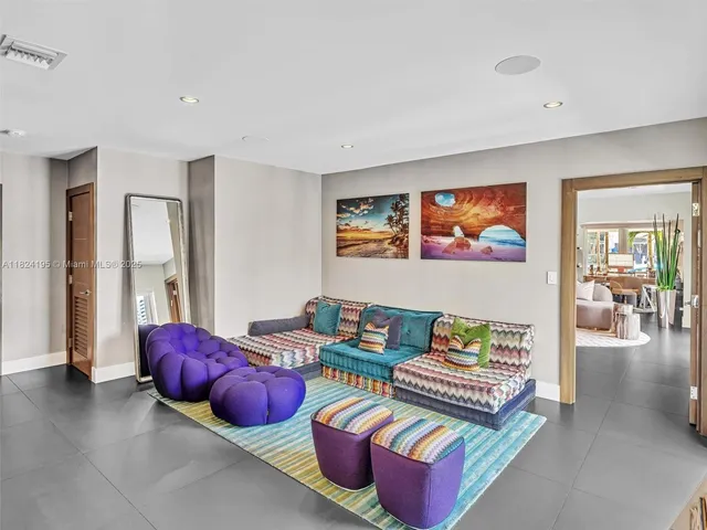 a bedroom with a large bed and a potted plant