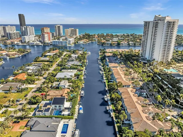 an aerial view of houses with yard