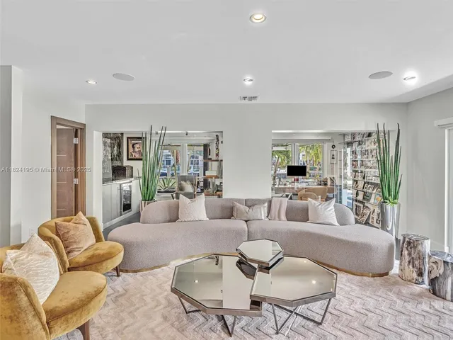 a bedroom with a bed couch and a window