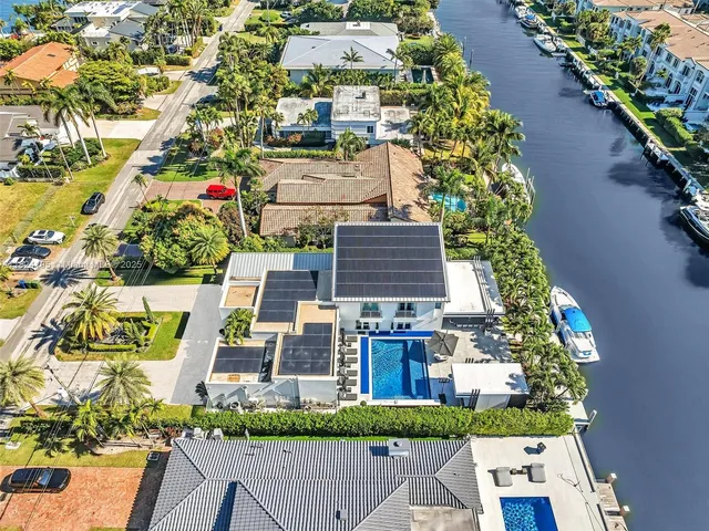 a view of multiple houses with a yard